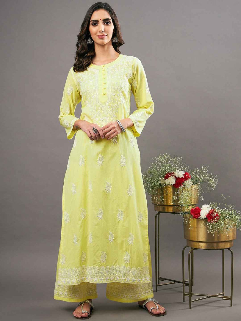 Yellow cotton kurta with chikankari and back ties with shararaset of 2